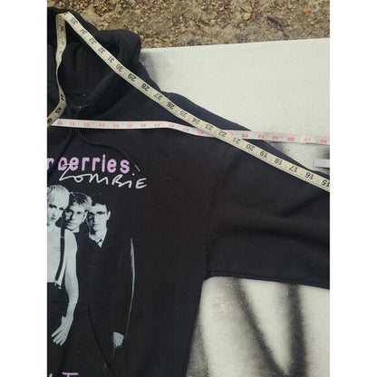 Black Cranberries 1994 tour hoodie with band graphic and measuring tape on shoulder for size