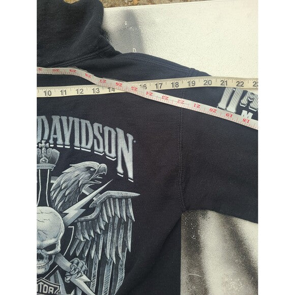 Black Harley Davidson hoodie with eagle and skull graphic and measuring tape across shoulder