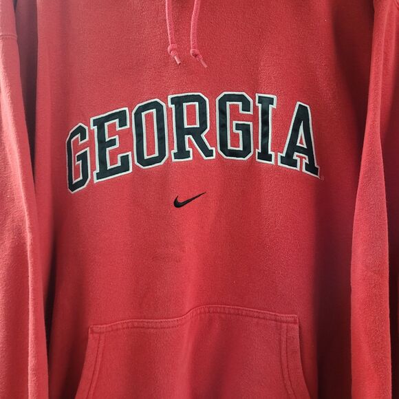 Red center swoosh Nike Bulldogs hoodie with Georgia text and front pocket from RetroVintage Thrift