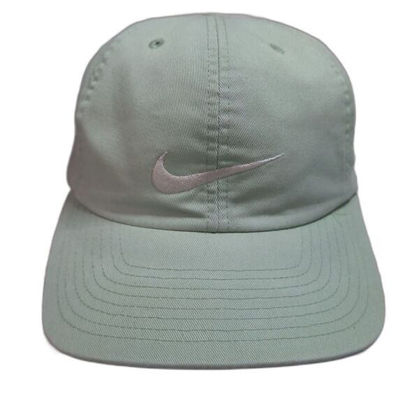 Vintage 90s Nike snapback hat in light green with embroidered white Nike swoosh logo