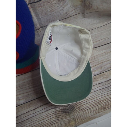 Inside view of white tag Nike cap 90s with green brim and RetroVintage Thrift branding