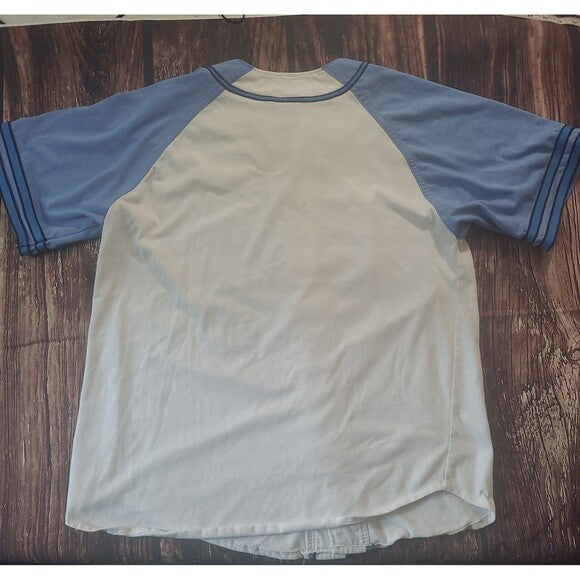 Back view of a vintage Starter Carolina Tarheels Baseball Jersey with blue sleeves and cream body