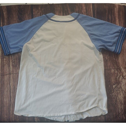Back view of a vintage Starter Carolina Tarheels Baseball Jersey with blue sleeves and cream body