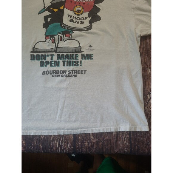 Vintage Open A Can of Whoop Inc humor shirt with cartoon character holding can and text Bourbon Street New Orleans