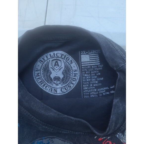 Close-up label of RetroVintage Thrift Vintage Y2K Affliction T-Shirt showing size and care instructions